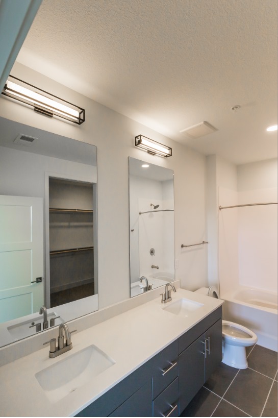 Refined Bathrooms at 225 Sycamore Apartments in Wichita, Kansas