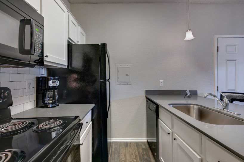 Kitchen with All Black Appliances at Ashton Oaks in McKinney, TX
