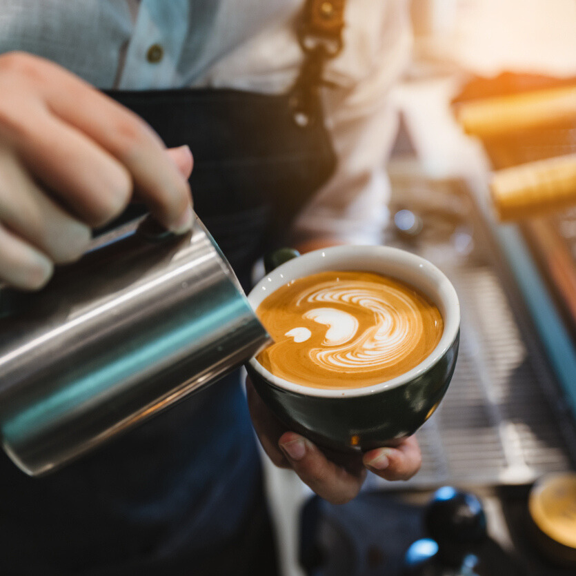 Barista making coffee latte art