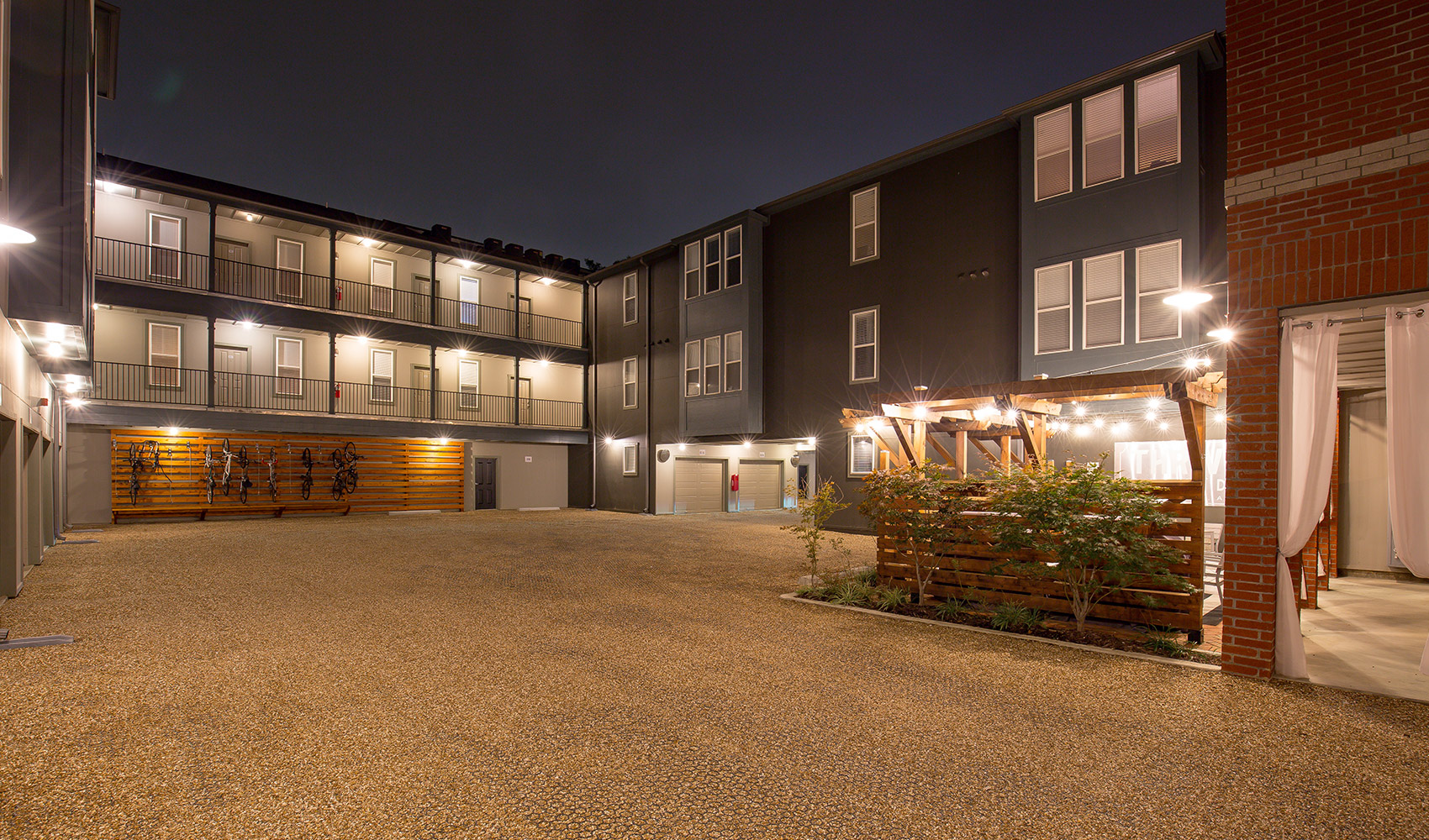 The Briq on 4th Street Apartment Exterior at night at 