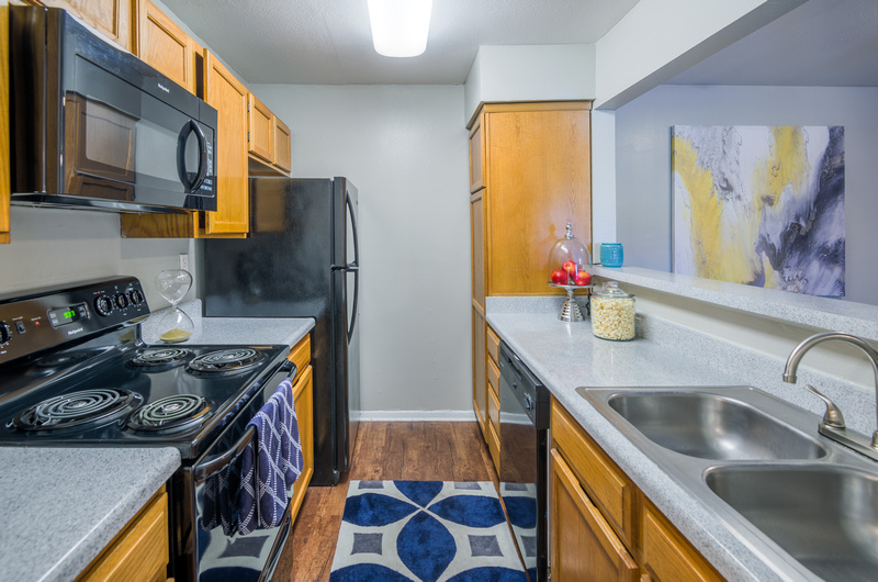 Galley-Style Kitchen at Topaz Apartments in San Marcos, TX