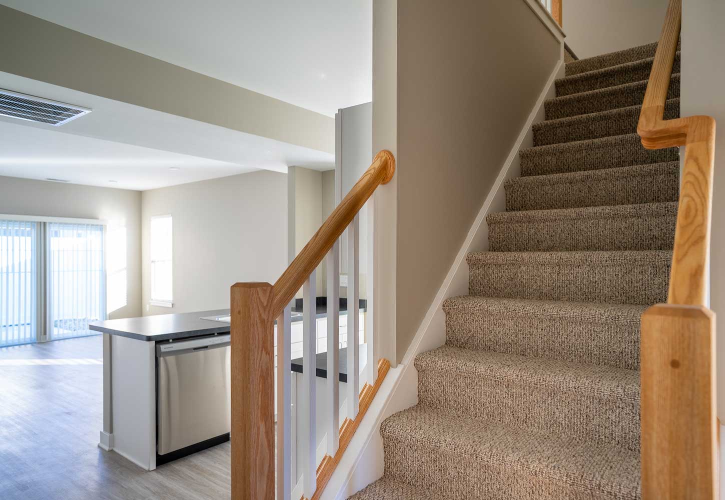 Stairs & kitchen at Champion Reserve Townhomes in Victor, NY