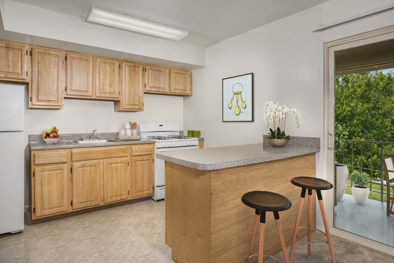 Well equipped kitchen with a breakfast bar at Chestnut Hill Apartments 
