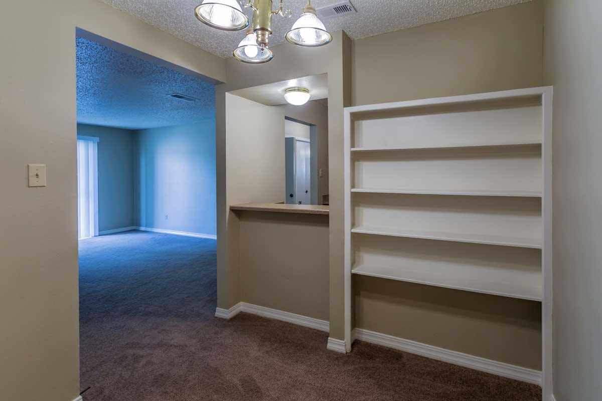 Dining Room with Built-In Shelving Available at Chevy Chase Apartments in Nacogdoches, Texas