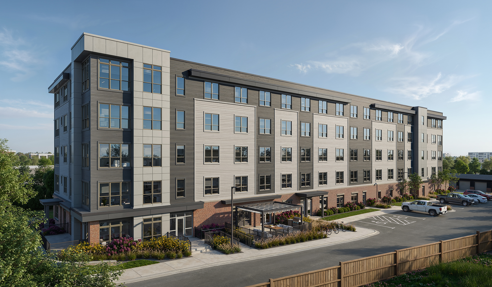 Exterior view of Conway at Huxley Yards, an affordable apartment community in Madison, WI with contemporary architecture, landscaped grounds, and welcoming residential entrances.