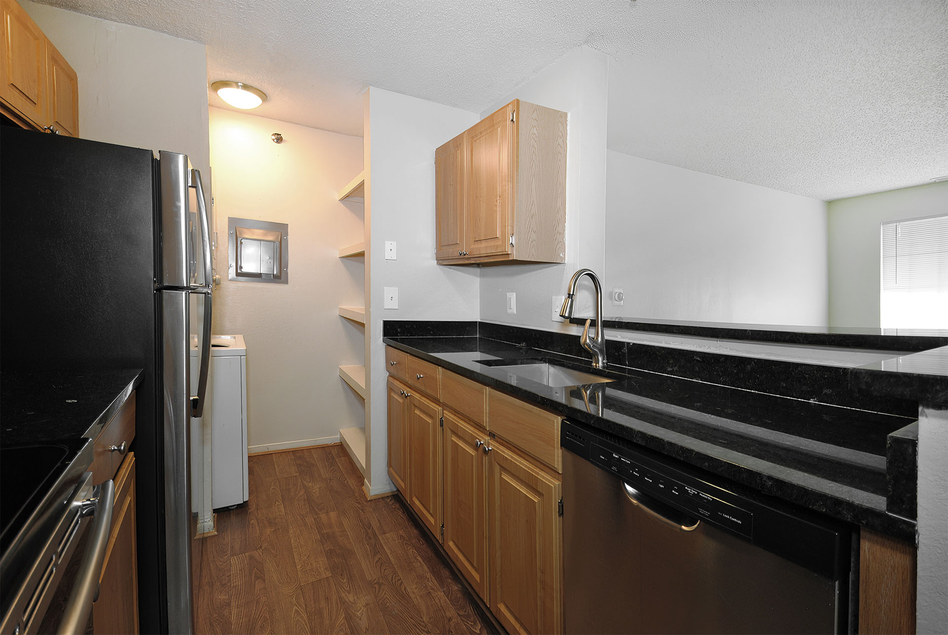 Open Kitchen with Breakfast Bar and Laundry