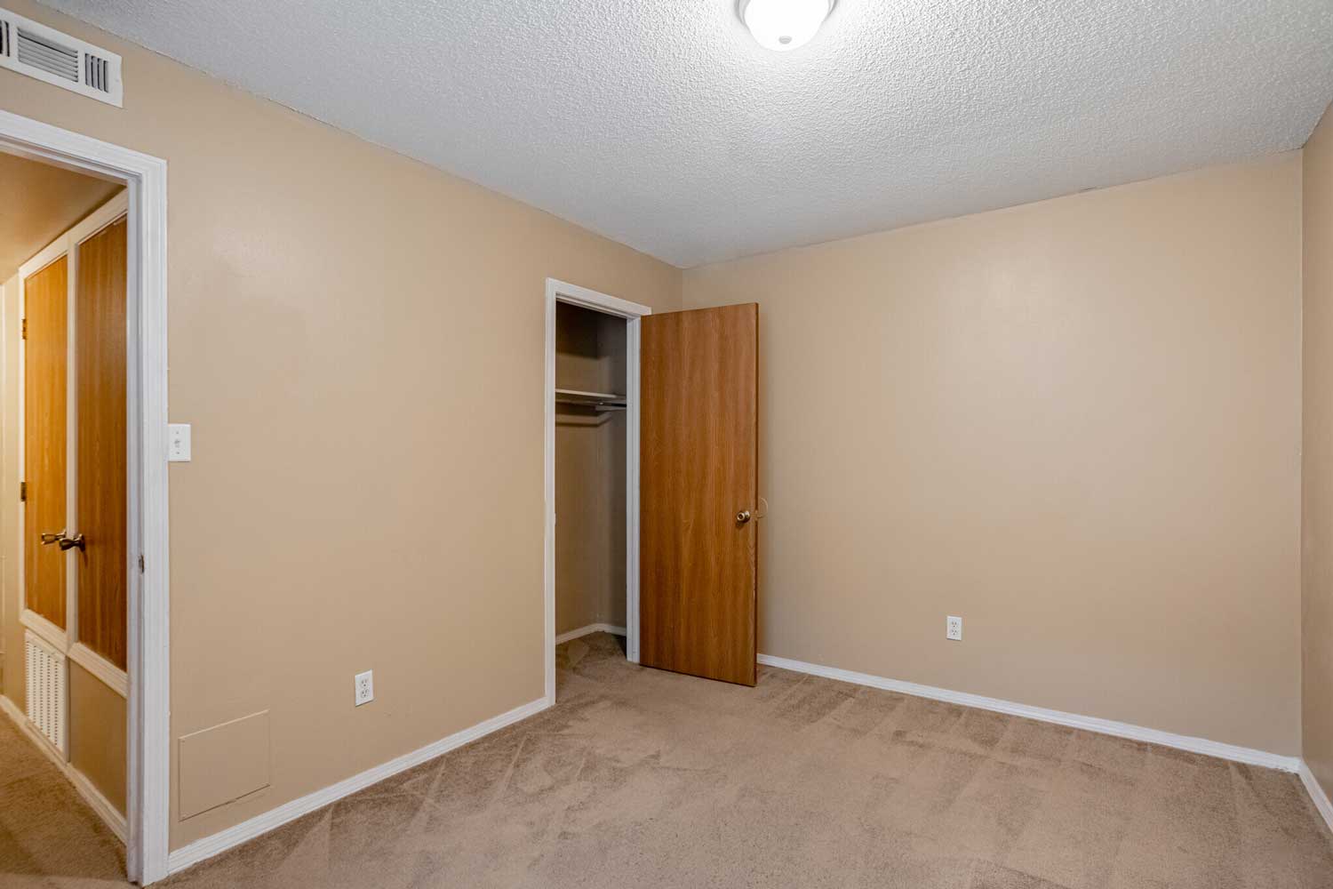 Carpeted Bedrooms at Crown Ridge Apartments in Fayetteville, AR