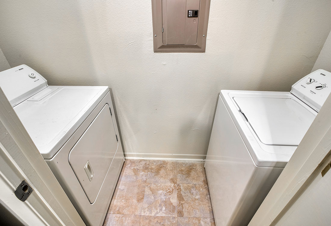 In-Unit Laundry Room at Cypress Bend Apartments in West Beaumont, TX