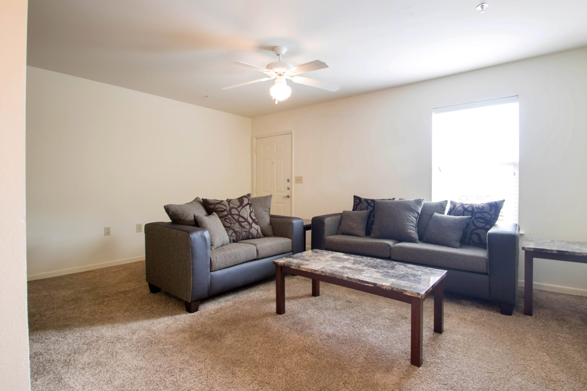 Well-Lit Living Area at Cypress Bend Apartments in West Beaumont, TX