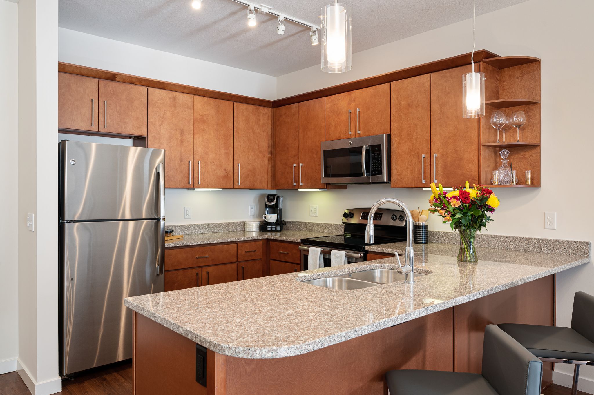 Modern Kitchen with Countertops at Domain City Center Luxury Apartments in Lenexa, KS
