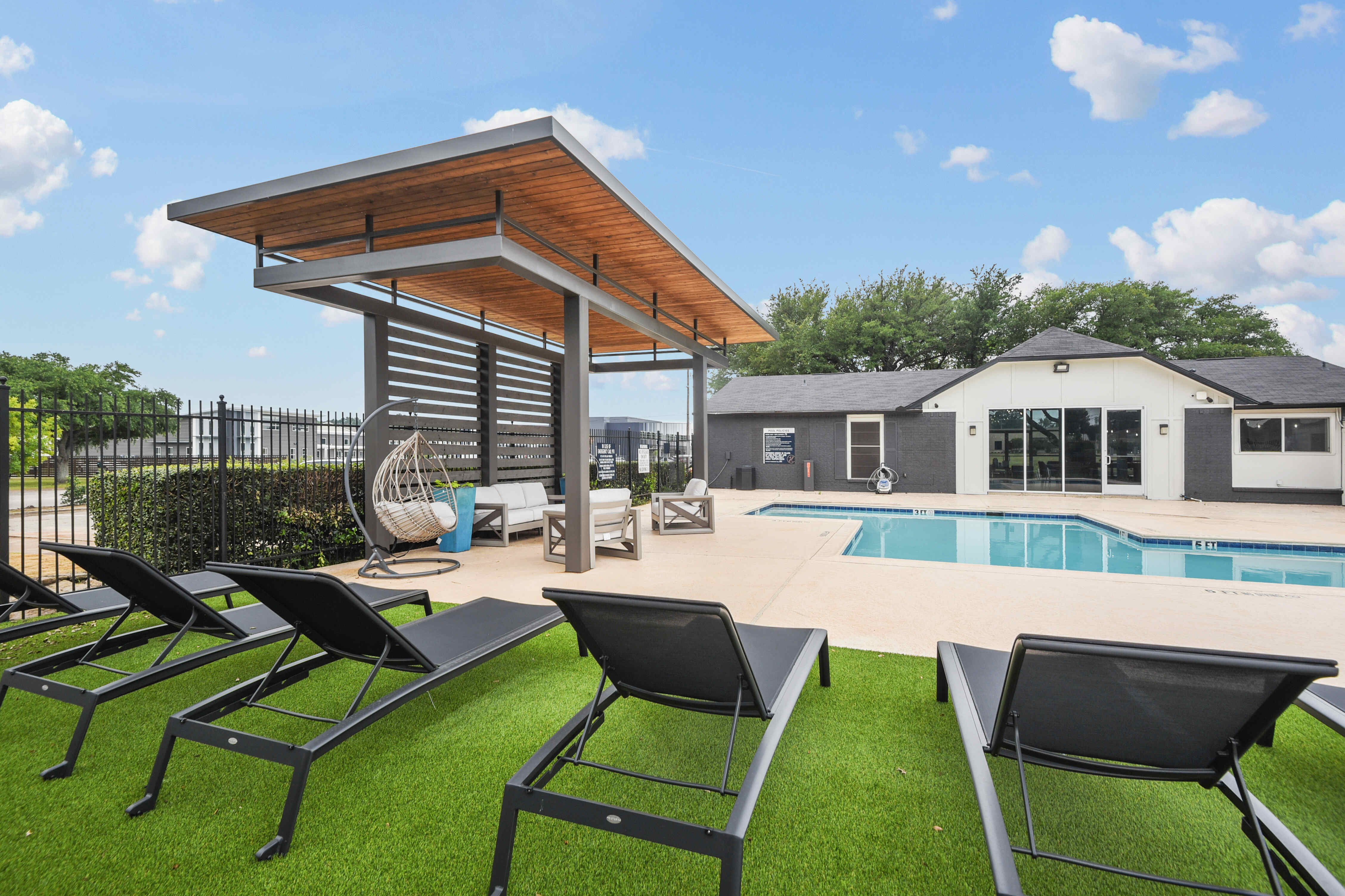 Poolside Sun Loungers & Pergola in Hazelwood Apartment Homes