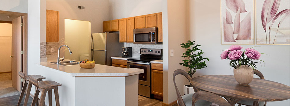 Fully Equipped Kitchen with Breakfast Bar at Fairfax Apartments in Omaha, NE.
