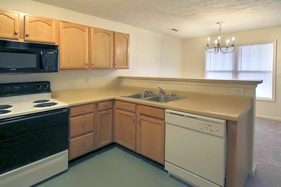 Kitchen with Countertops at Falcon Crest Apartments in Louisville, Kentucky