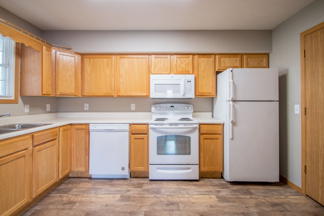 White Appliances and Wood-Look Flooring at Fieldstone Apartments