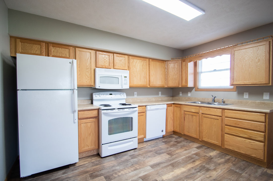 Spacious Kitchen with Wood-Look Flooring at Fieldstone Apartments in Lincoln, NE