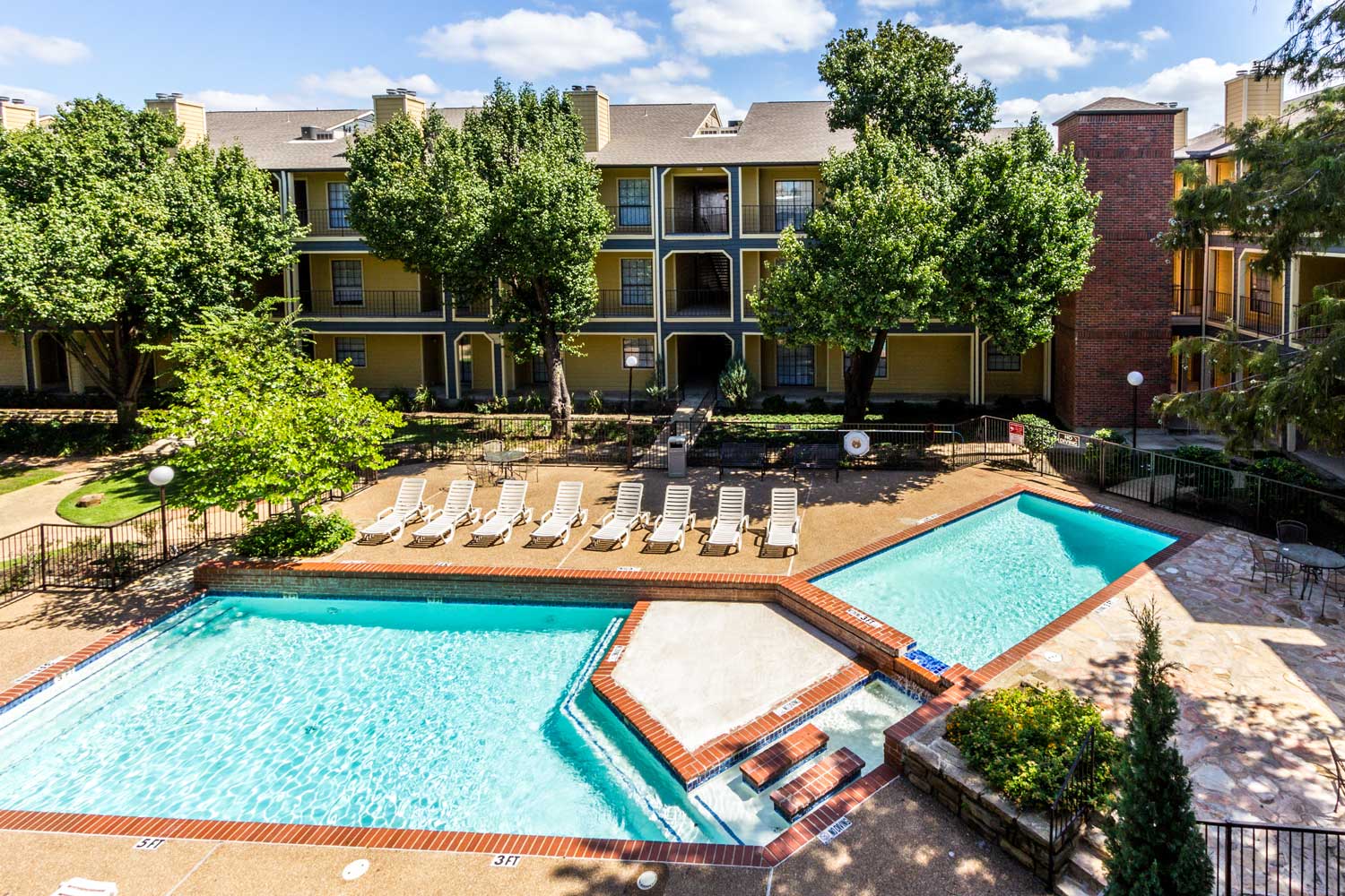 Two Conjoined Swimming Pools at Forest Hills Apartments in Dallas, TX