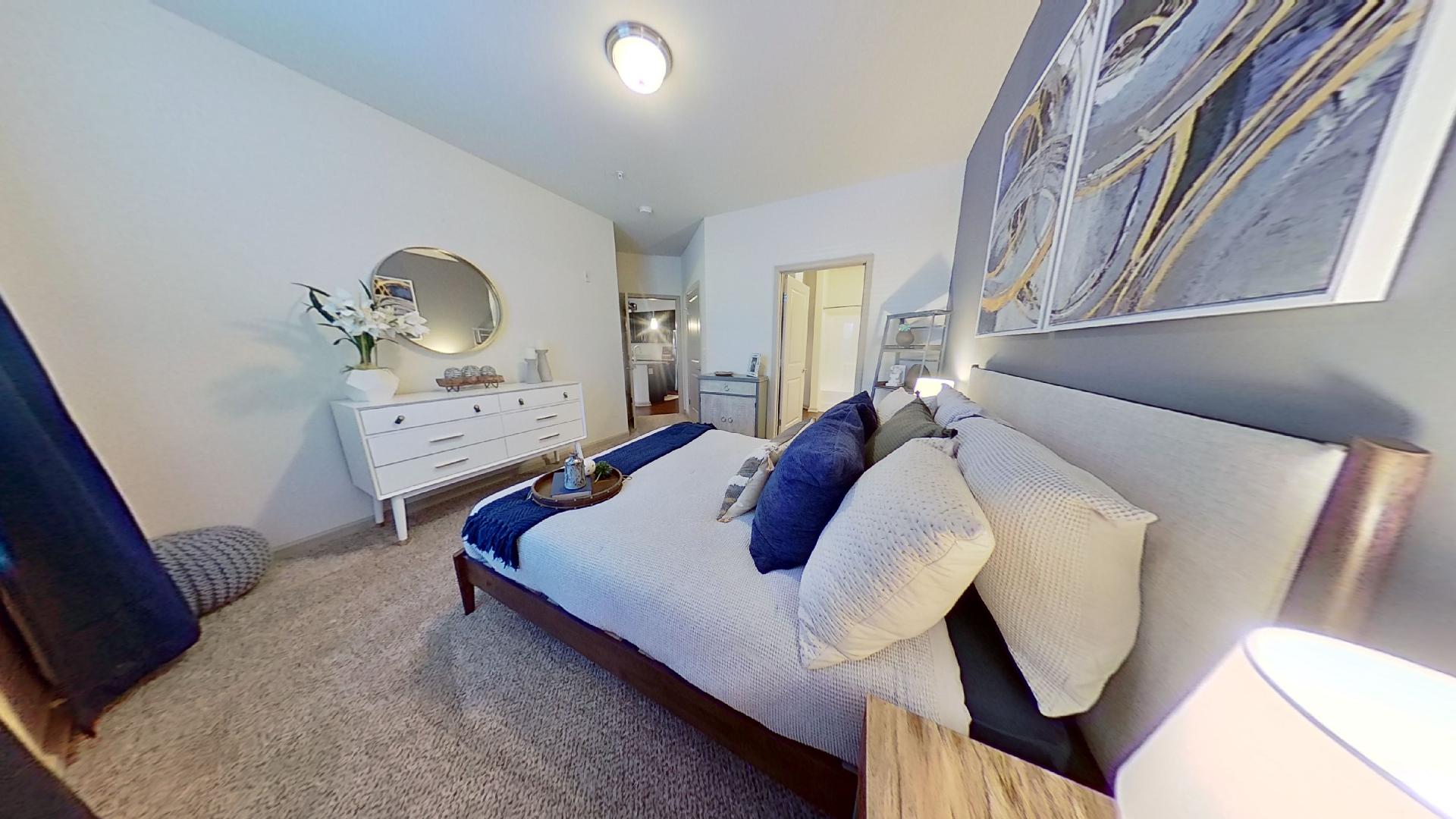 Updated White & Artwork Bedroom Designs at The Reserve at Fountainview Apartments