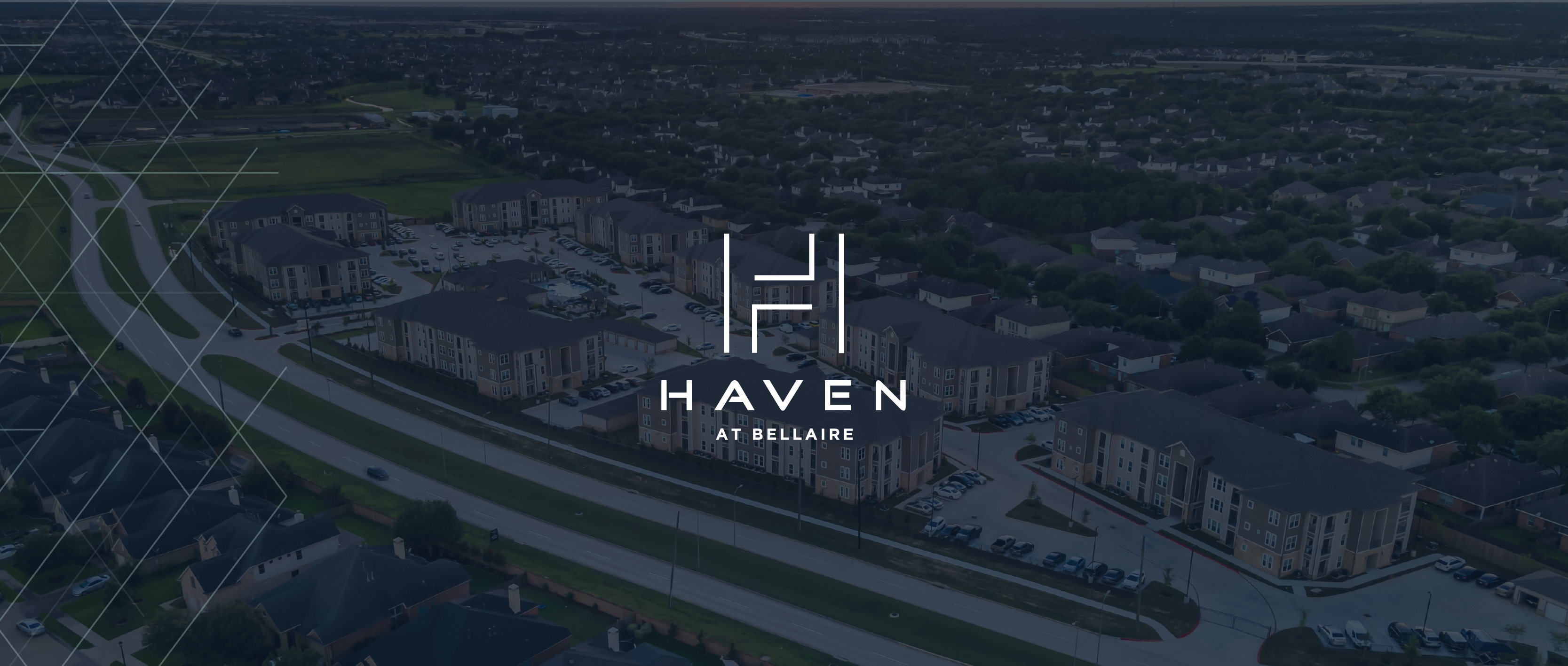 Haven At Bellaire Apartments Logo Over Building Rendering