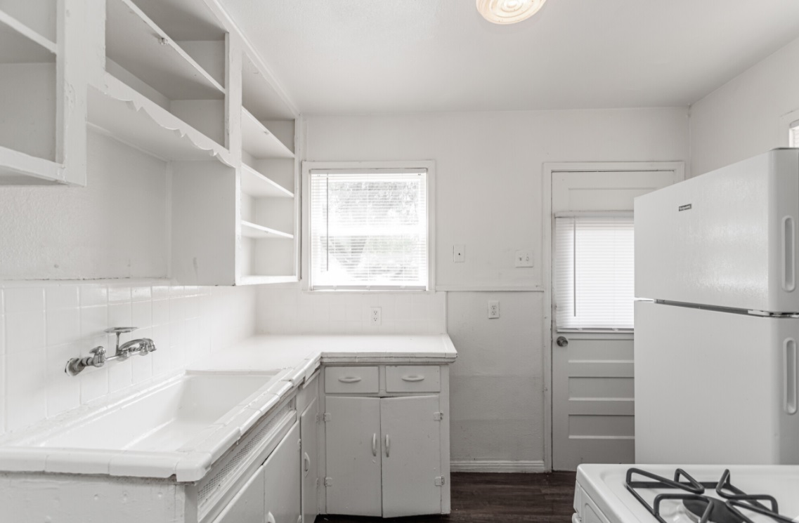 White-themed Kitchen Space at Highland Hills Apartments in San Antonio, Texas