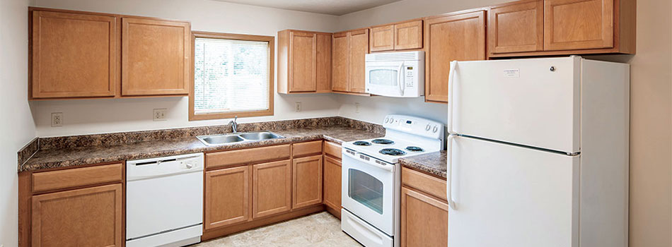 Fully Equipped Kitchen with White Appliances