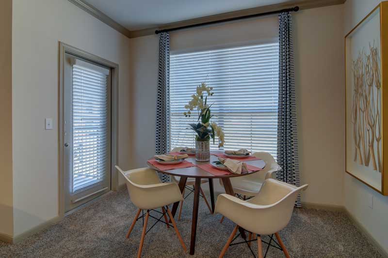 Dining Area with Door Leading to Patio at Hilltop at Shavano Apartments in San Antonio, TX