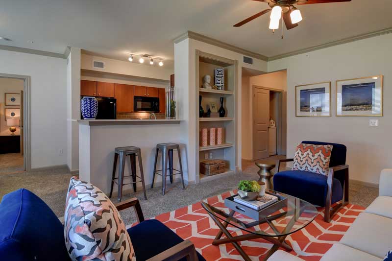 Living Room with Built-In Bookshelf at Hilltop at Shavano Apartments in San Antonio, TX