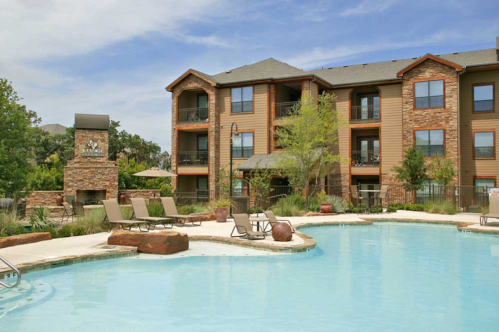 Pool with Outdoor Fireplace at the Hilltop at Shavano Apartments
