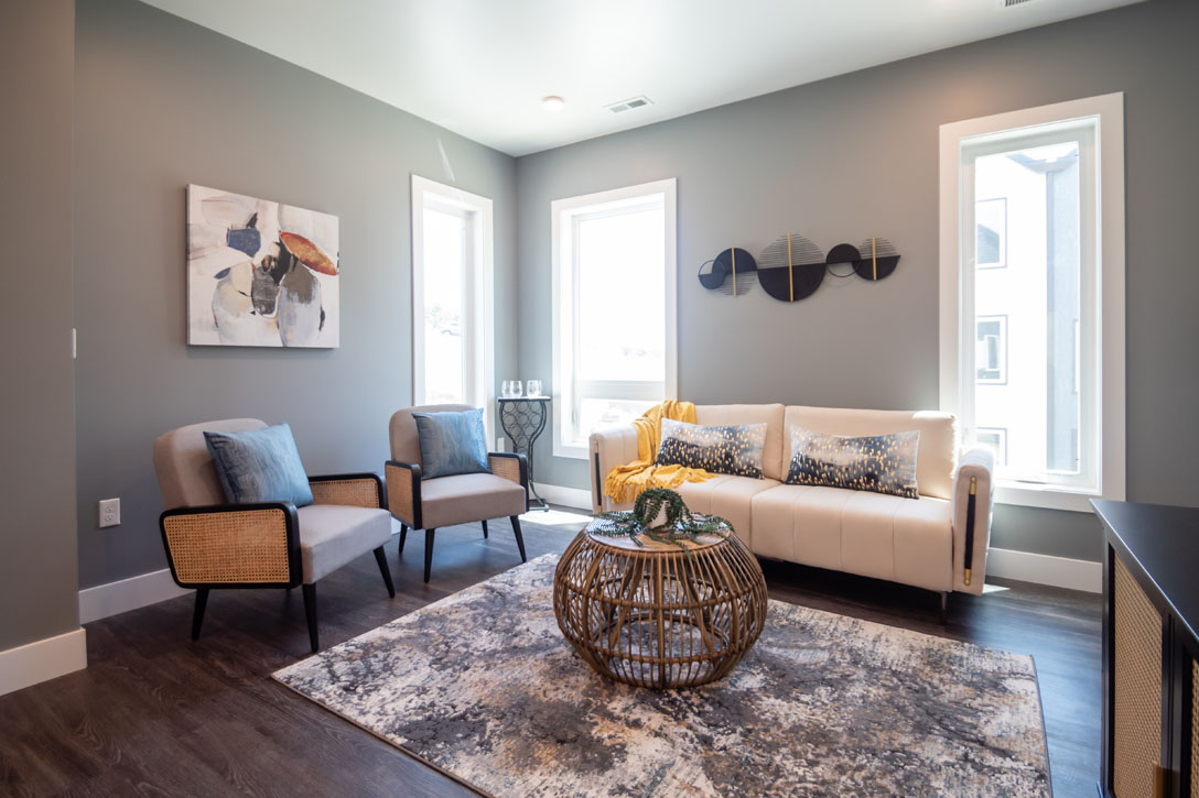 Beautiful, Modern, and Well-Lit Living Room at Juniper Rows at Olde Towne
