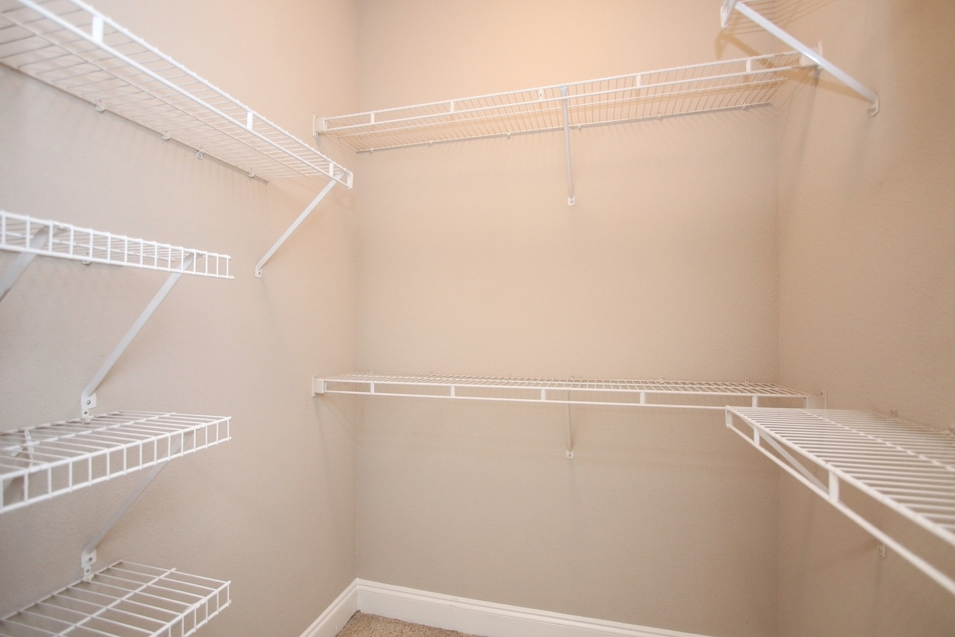Walk-In Closets with Shelving at King's Cove Apartments in Kingwood, Texas 