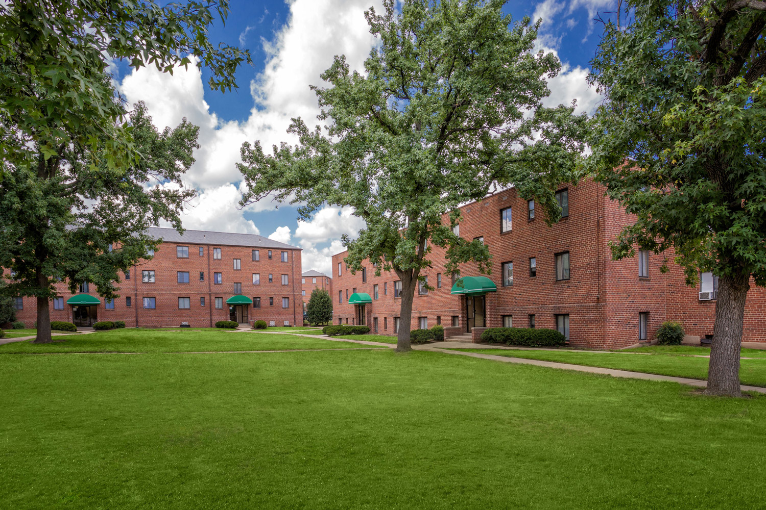 Beautiful views of green courtyards at Liberty Place Apartments in Langley Park, MD