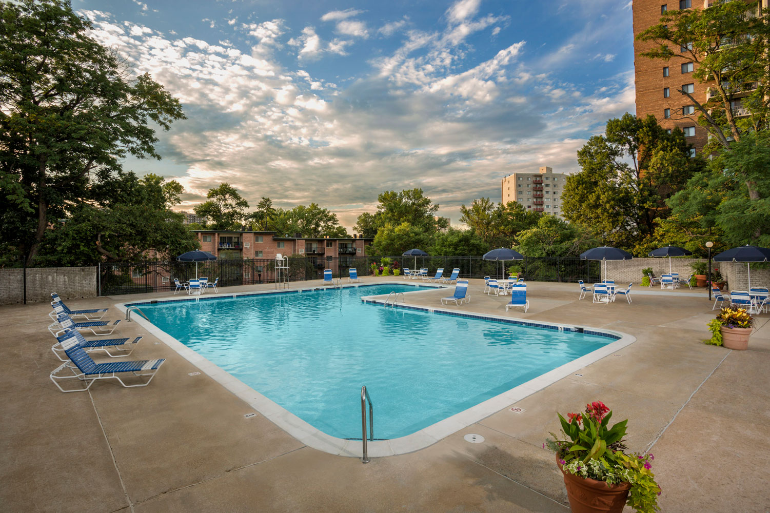 Relaxing swimming pool with sundeck at London Park Towers Apartments in Alexandria, VA