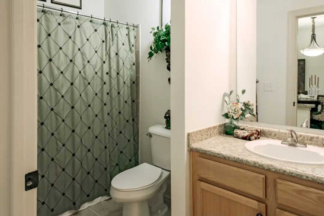Toliet and Bath Area at Mainstreet at River Ranch Apartments in Lafayette, LA