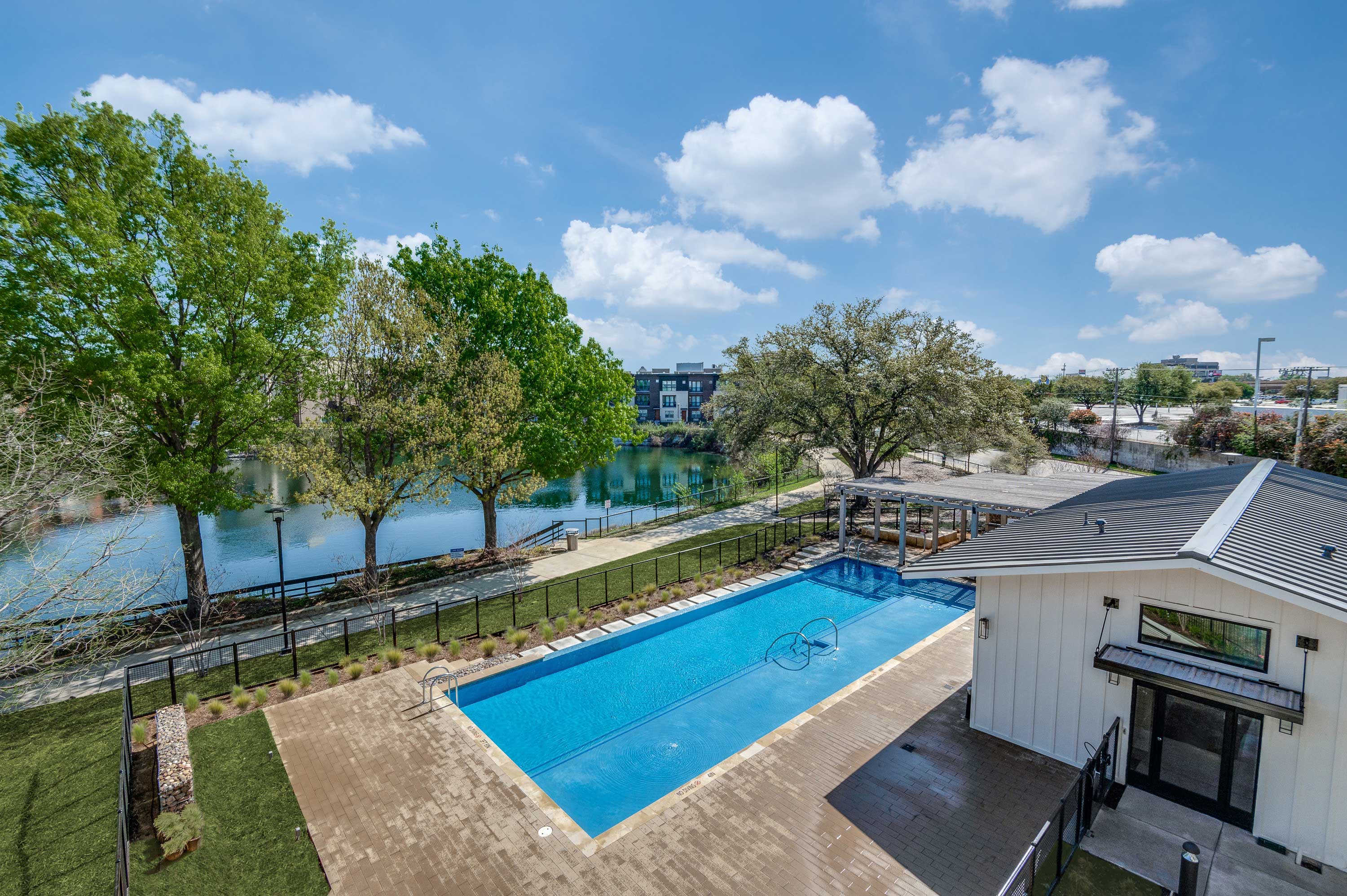 Infinity Edge Pool overlooking 2-Acre Blue Lake at Midway Row House in North Dallas.
