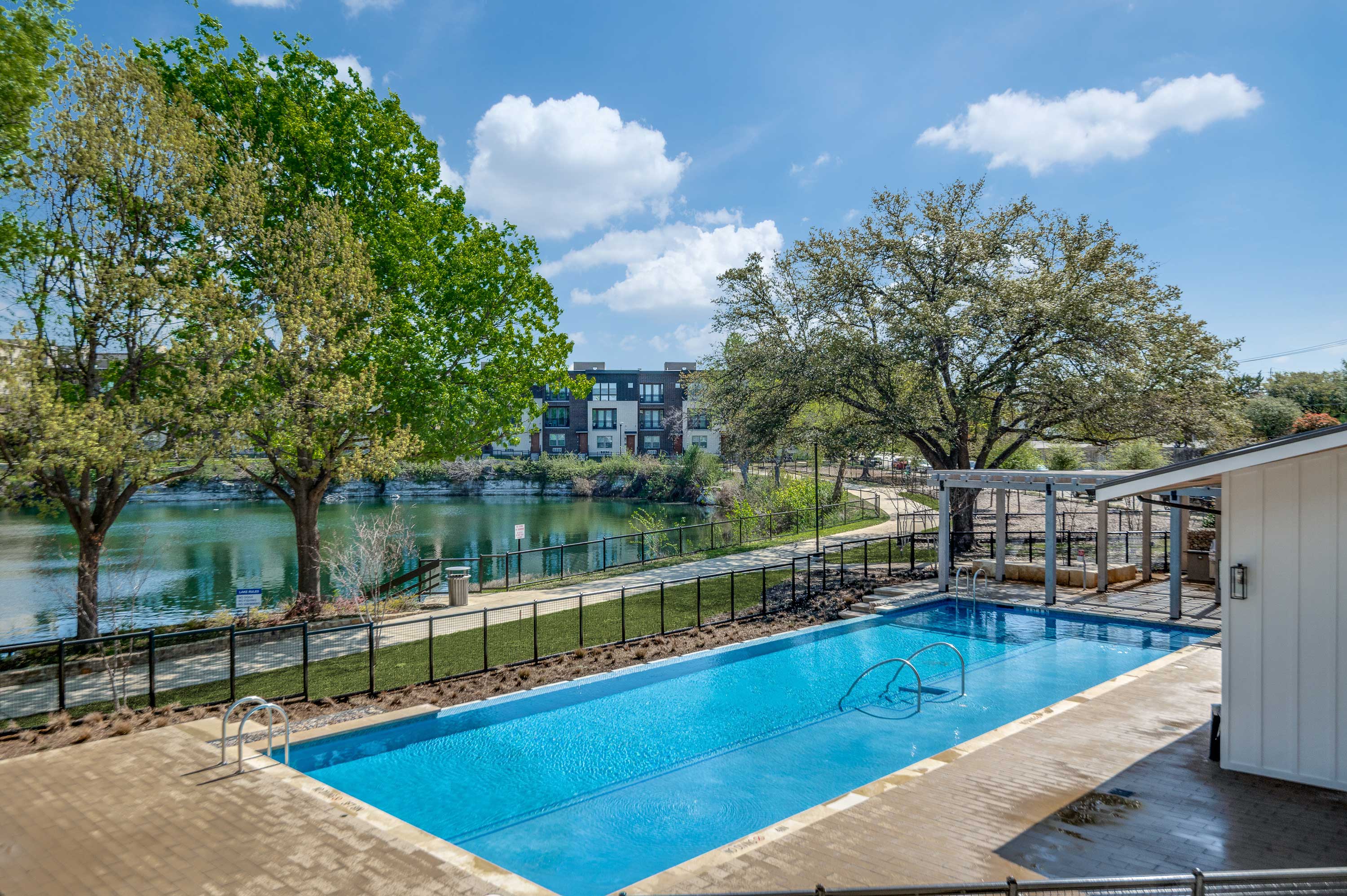 Gated Pool Area Overlooking 2-Acre Blue Lake at Midway Row House in North Dallas. 