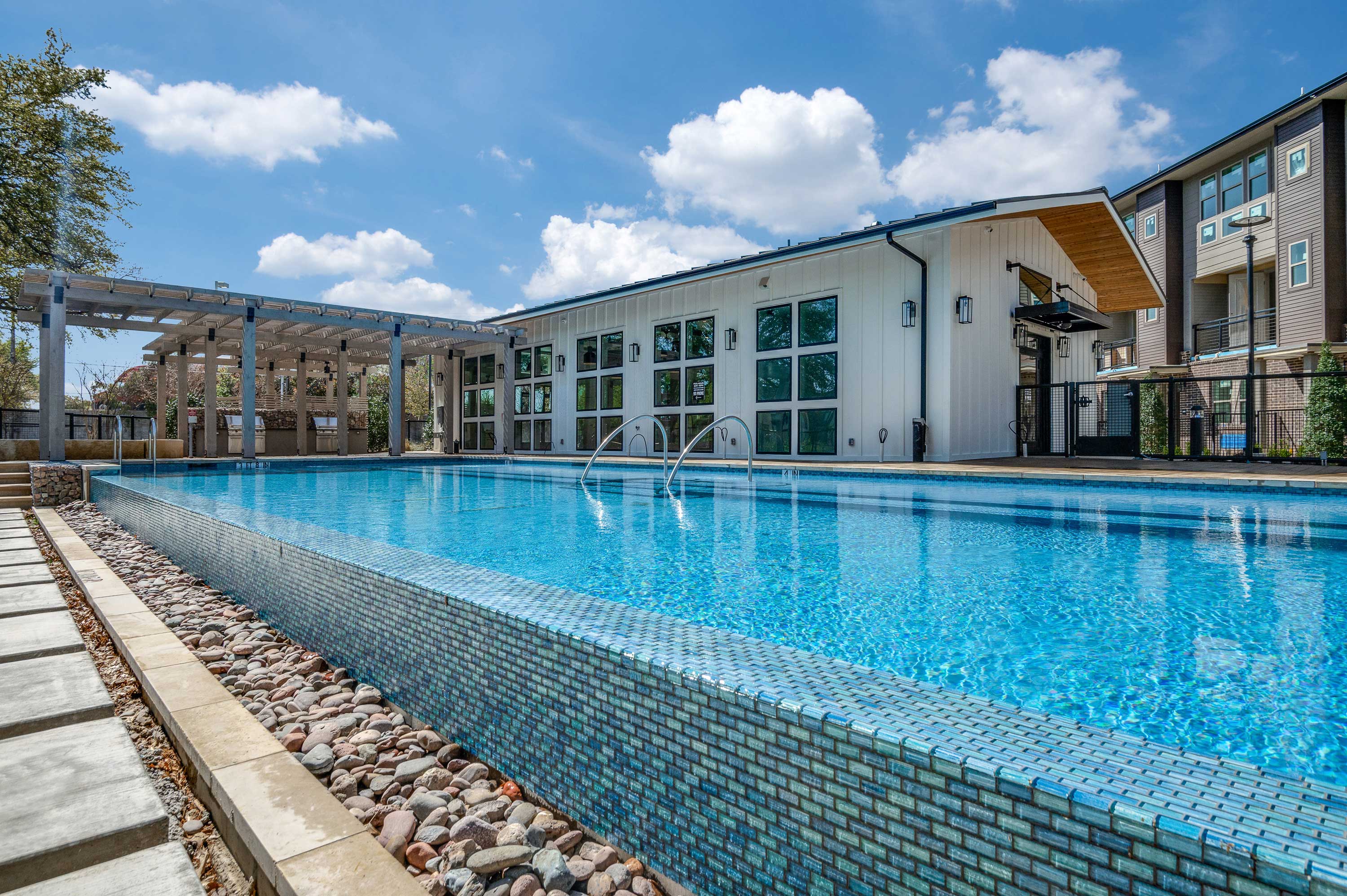 Take a Dip in our Infinity Edge Pool at Midway Row House in Addison, Texas.
