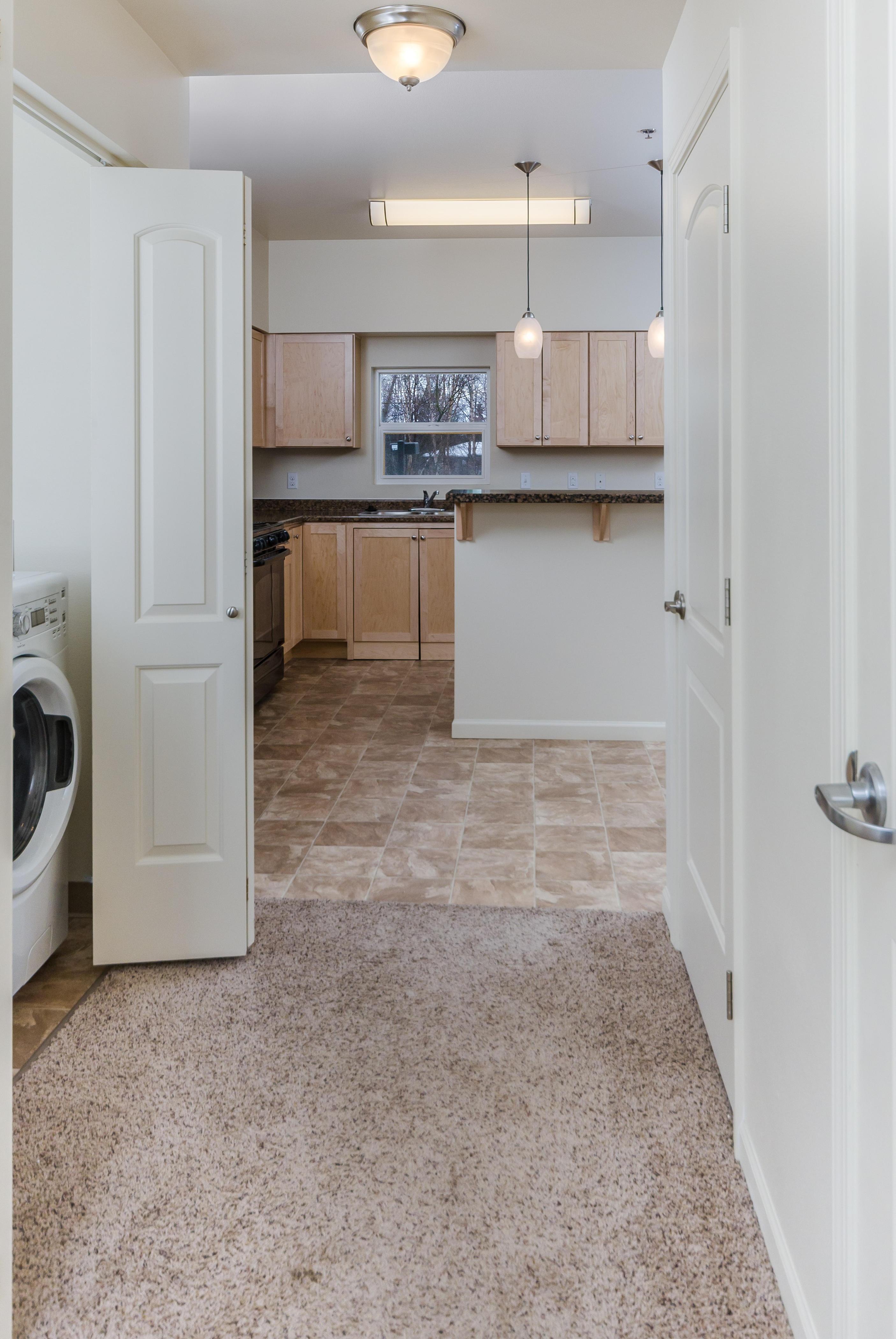 2BR Laundry Area and Tiled Kitchen