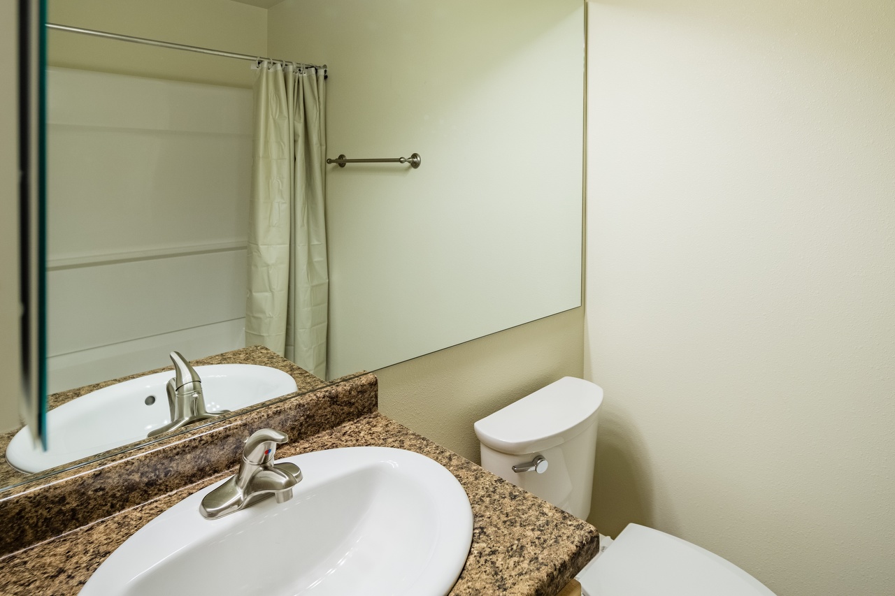 1BR Assigned Bathroom with Tub and Shower Combo and Vanity Space