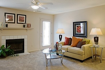 Living Area with Cozy Wood Burning Fireplace at the Oak Pointe Apartment Homes in Simpsonville , SC