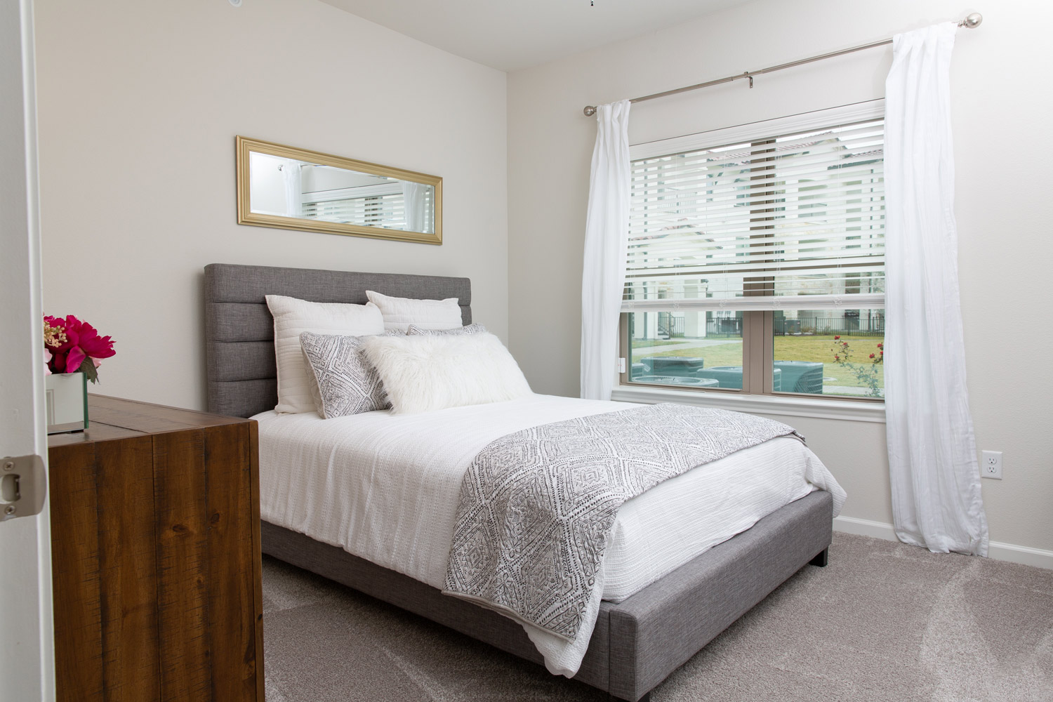 Updated White Bedroom Interiors at Oxford at Santa Clara Apartments in Pflugerville, Texas
