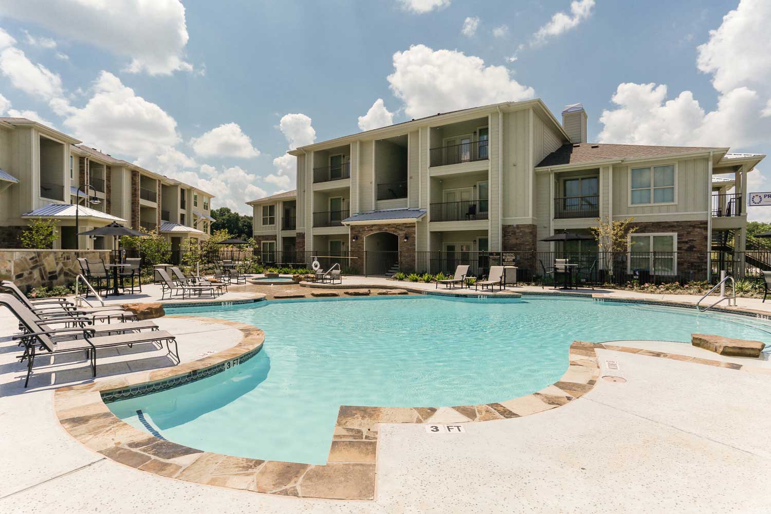 Sparkling Pool With Poolside Sundecks at Oxford at the Ranch Apartments