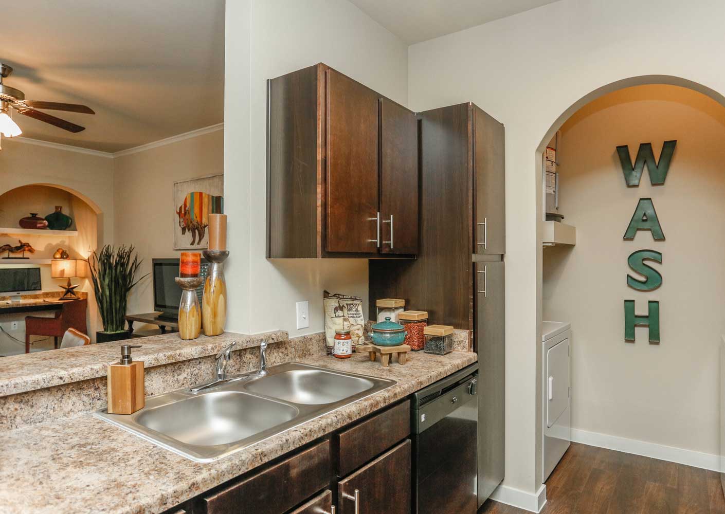 Kitchen With Wooden Cabinetry at Oxford at the Ranch Apartments