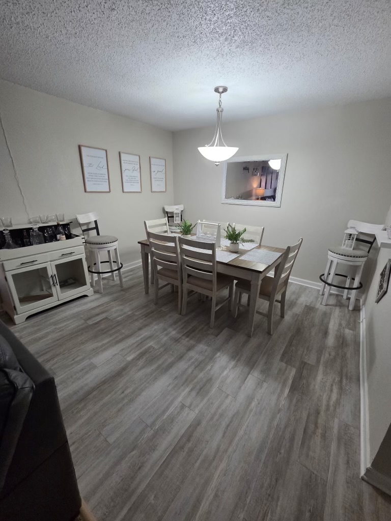 Open Dining Area With Overhead Lighting