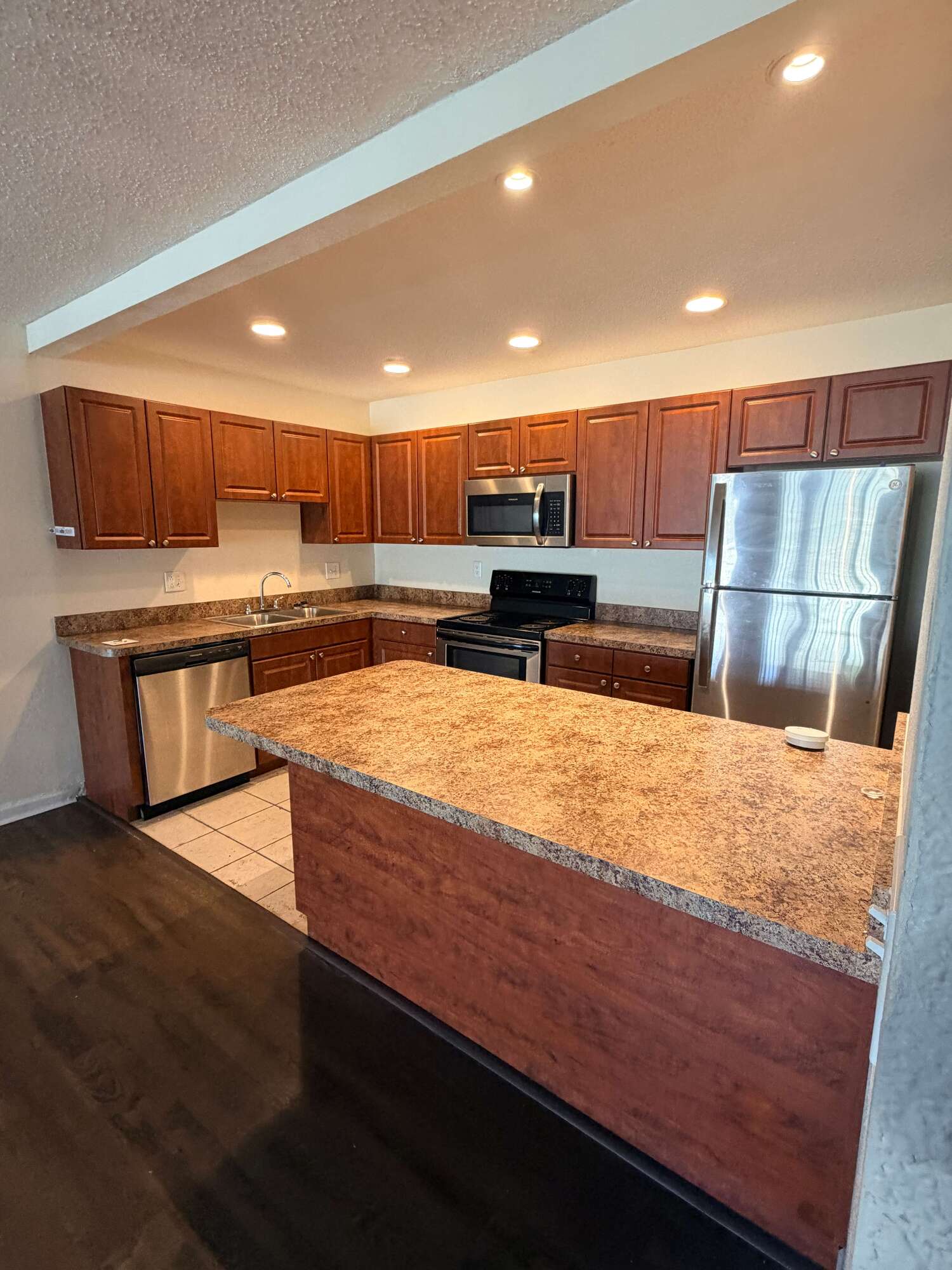 Spacious Kitchen Space with Wooden Cupboards & Cabinetry