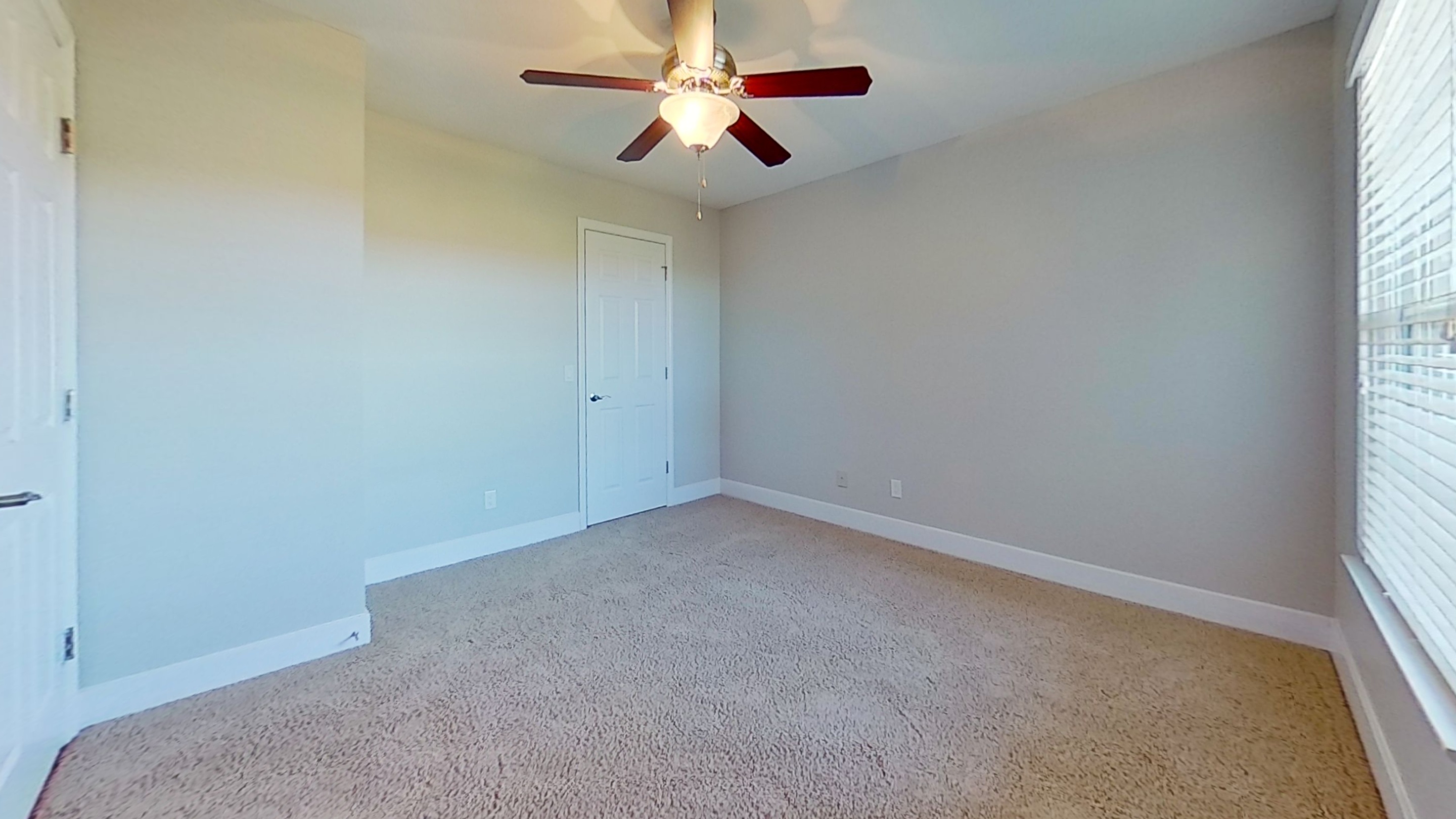 Bedroom With Ceiling Fan at Polo Downs Apartments in Fenton, MO