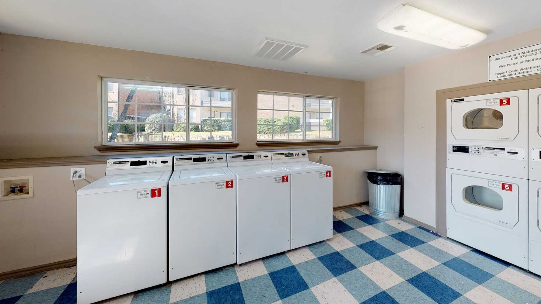 On-Site Laundry Care Center at Ridgeview Place Apartments in Irving, TX