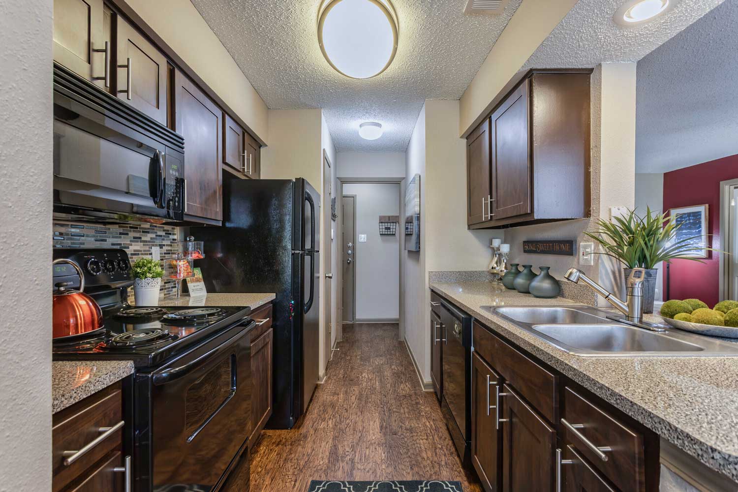 Galley-Style Kitchen at Ridgeview Place Apartments in Irving, TX