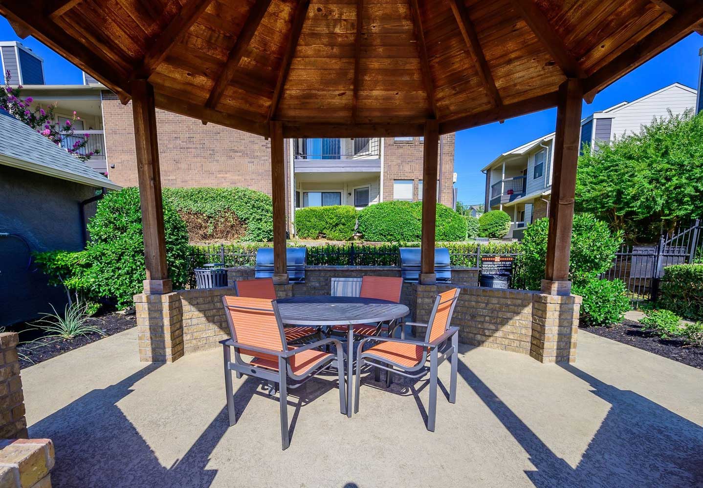 Outdoor BBQ Grills with Seating at Ridgeview Place Apartments in Irving, TX
