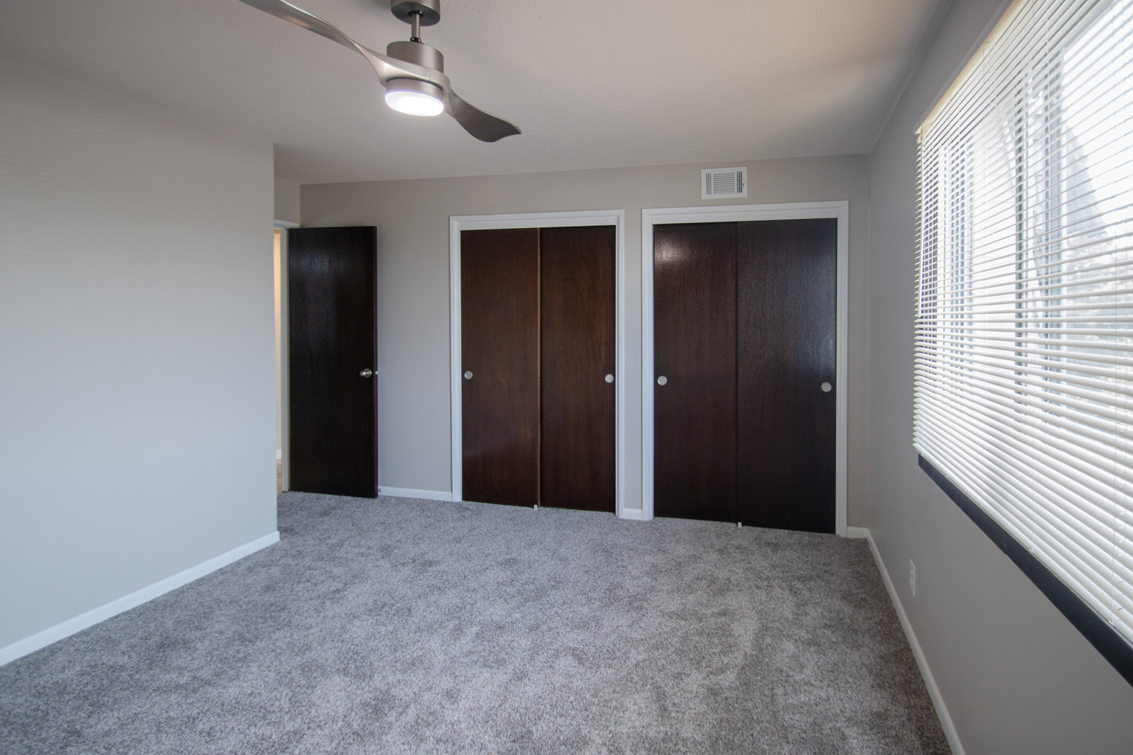 Bedrooms with Ceiling Fans at Pinehill Park Apartments in Bellevue, NE