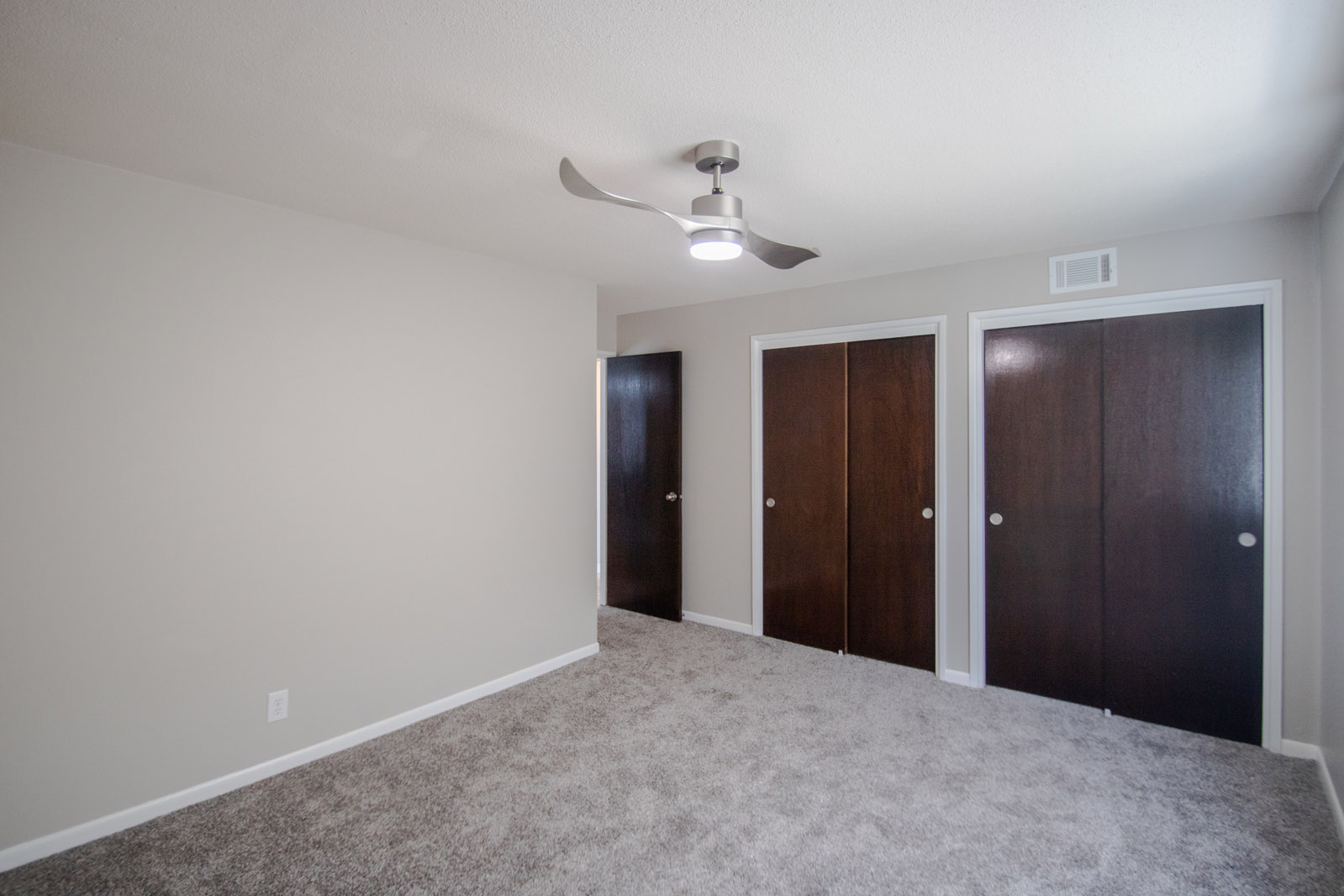 Carpeted Bedrooms at Pinehill Park Apartments in Bellevue, Nebraska