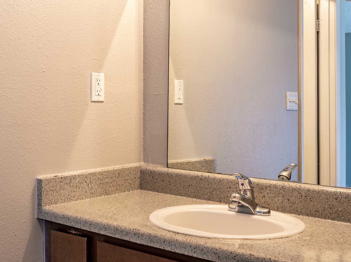 Single Vanity Bathroom at Rustic Woods Apartments in Tulsa, Oklahoma